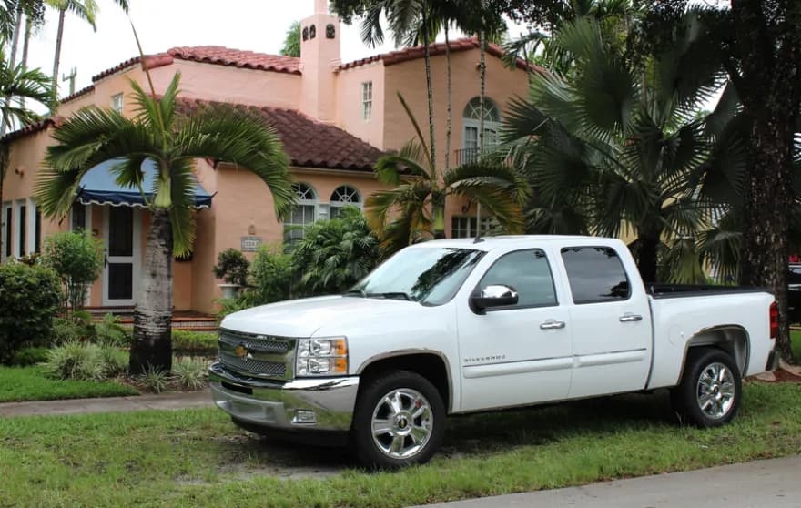 Two people moving boxes