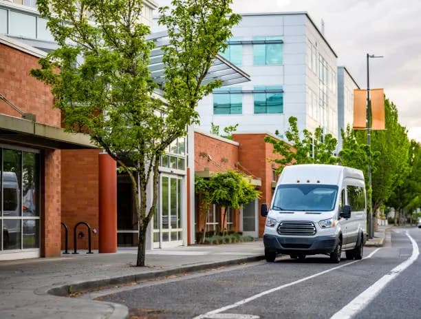 Two people moving boxes